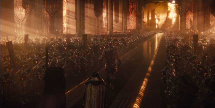 Steppenwolf flanked by parademons on Apokalips