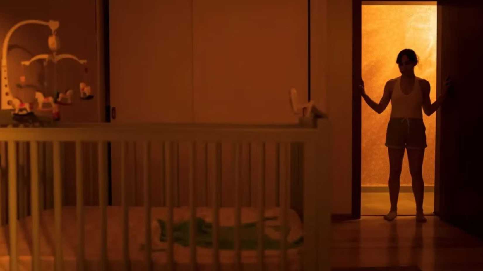 Huesera The Bone Woman character looking at the crib