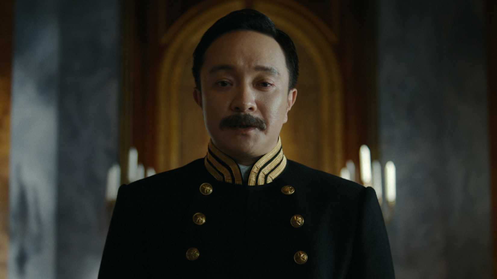 Kawaji standing above his allies in Last Samurai Standing