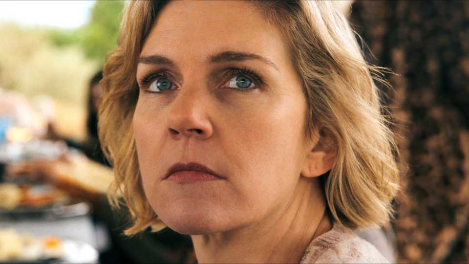 Rhea Seehorn as Carol looking seriously in Pluribus