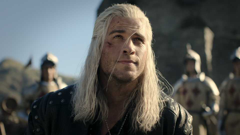 Liam Hemsworth as Geralt smiling slightly in The Witcher season 4