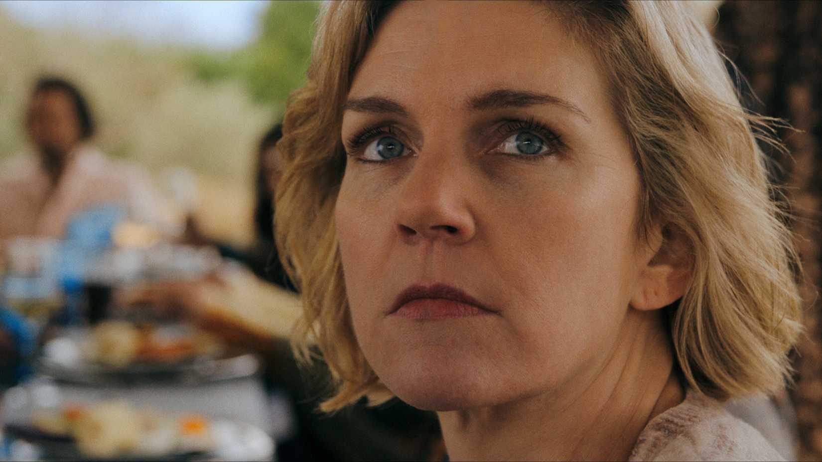 Rhea Seehorn as Carol Sturka looking worried in Pluribus