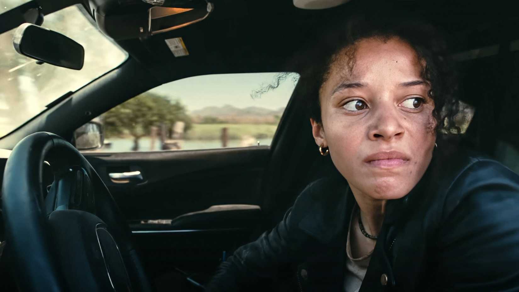 Willa looking angry as she turns her car around in One Battle After Another