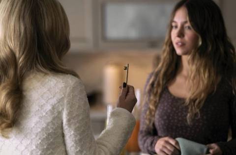 Amanda Seyfried holding up a key to Sydney Sweeney in The Housemaid